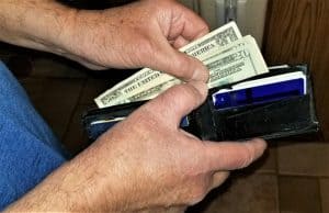 Finance and Wealth! Man Removing Cash From His Wallet to Pay for Something! NOMINATED!!